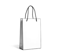 Paper shopping bag with handles on white background. Mockup for design