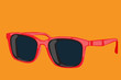 Red sunglasses isolated on Orange background