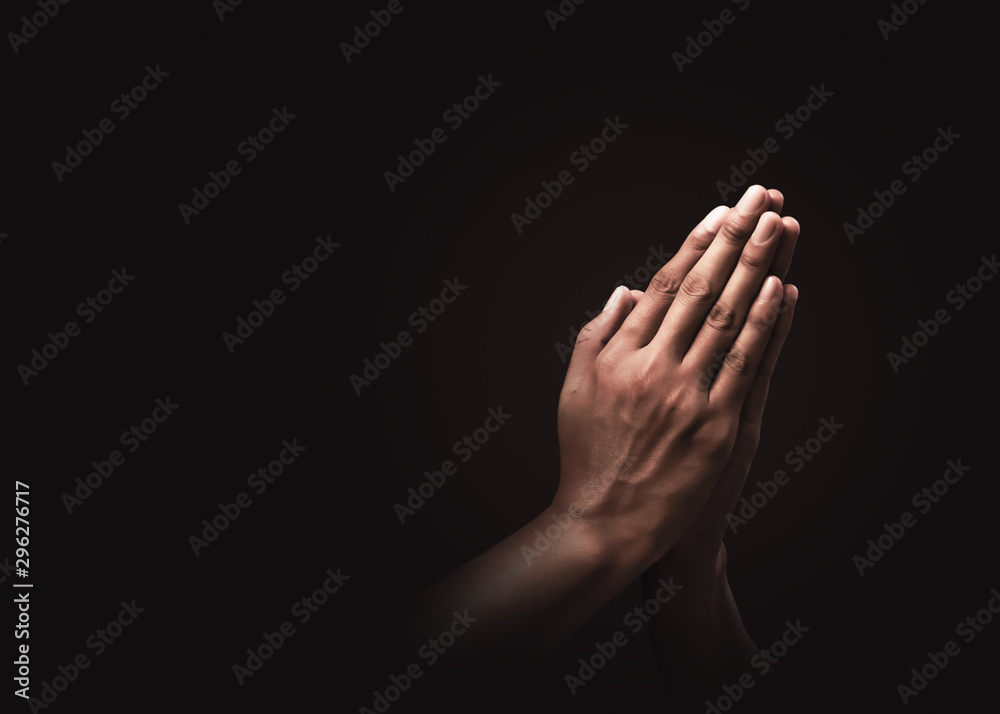 Praying hands with faith in religion and belief in God on dark background. Power of hope or love and devotion. Namaste or Namaskar hands gesture. Prayer position. - obrazy, fototapety, plakaty 