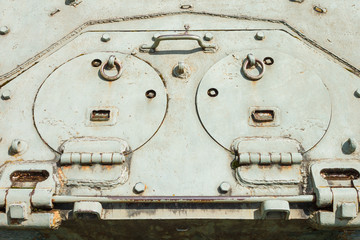 Details of the old Soviet tank. Military green camouflage metal background