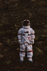 Wall Mural - astronaut exploring a new planet. searching for a new home for humanity. concept about science and n