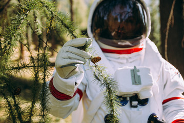 Wall Mural - astronaut exploring a new planet. searching for a new home for humanity. concept about science and n
