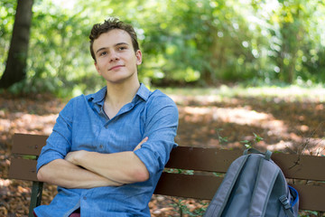 Teenager on the bench in the park