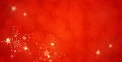 Christmas time. Abstract glitter background with stars and snowflakes. Wintertime. Red colors.