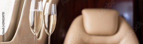 Cuadros en Lienzo panoramic shot of champagne glasses in private jet