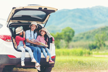 Group Asian Family Children Checking Map And Pointing On The Car Adventure And Tourism For Destination And Leisure Trips Travel For Education And Relax In Nature Park .  Travel Vacations