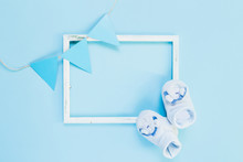 Newborn Flat Lay Postcard. Baby Booties Shoes For Boy And Girl On A Blue Pink Background. Congratulations On The Birth Of A Newborn Baby With Copy Space.