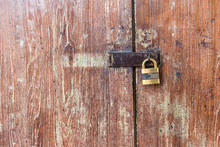 Wooden Door With Lock. Lock On An Old Wooden Gate. Old Padlock On Closed Doors. Master Key And Old Wood Door For Lock