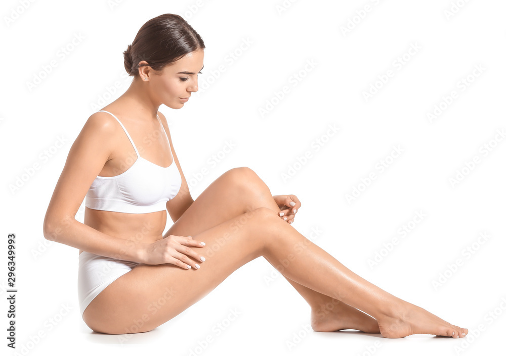 Woman with beautiful legs after depilation on white background