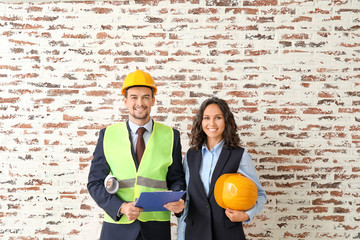 Wall Mural - Portrait of architects against brick wall