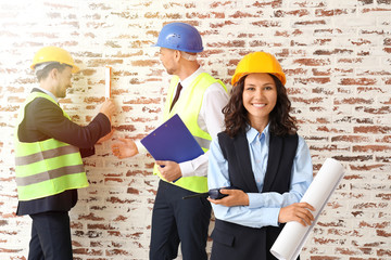 Wall Mural - Portrait of architects against brick wall