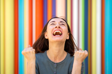 Wall Mural - Close up joyful older woman celebrating with fist pump