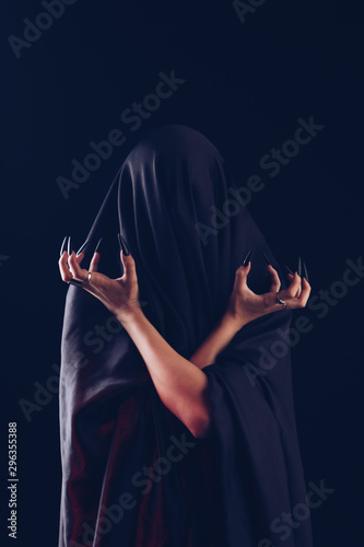 A Girl With Long Hair In The Image Of A Witch Is Trying To Set Herself