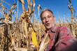 © RGtimeline - Excited Farmer Taking Selfie Portrait with Ripe Corncob on Corn Field