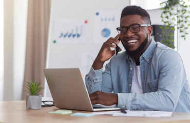 Poster - Cheerful Entrepreneur Speaking On Mobile Phone While Working In Office