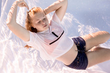 Teenage Girl Wearing T-shirt Diving Under Water