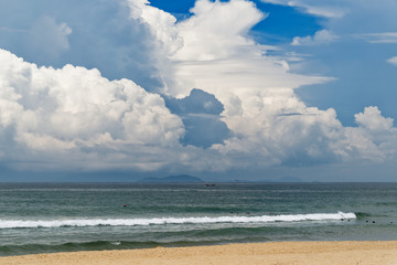 Naklejka na meble Sandy beach against amazing blue cloudy sky