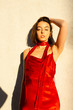 © Christopher Michael - Portrait of model in red dress posing outdoors