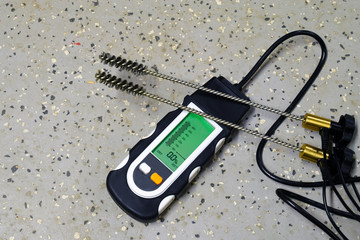 Wall Mural - Moisture meter with  probes for humidity measurement from concrete surfaces.