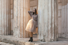 Teen Girl In Brown Tulle Skirt And Autumn Sweater