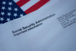 Social Security Administration Important Information letter next to flag of USA.