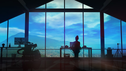 Wall Mural - Silhouette of a female videographer working in the studio in the evening.