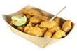 Kibbeling in a cardboard tray isolated on white background. Kibbeling is a Dutch snack consisting of battered chunks of fish. It is a very popular dish in the Netherlands.