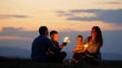 © MEDIAIMAG - Parents with kids have fun with sparklers in nature at sunset