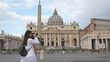 © MEDIAIMAG - Young woman takes pictures of the Papal Basilica of St. Peter in Vatican