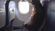 © MEDIAIMAG - Beautiful pregnant woman set safety belt fasten, airplane flight, safe travel