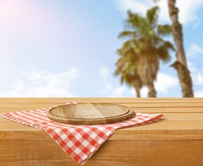 Canvas Print - Empty tray on tablecloth on wooden table