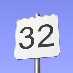 Number 32. Thirty two. Street sign on blue clear sky background