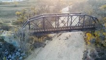 Iron Horse Trail Bridge Over Dry Riverbed In Santa Clarita, Aerial Panning View