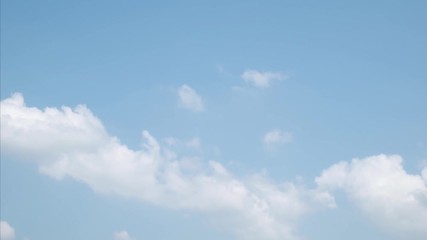 Wall Mural - time lapse white clouds on a blue sky. 4k fluffy white clouds moving during the day time
