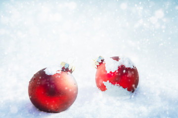 Wall Mural - Christmas red ornaments on white snow background