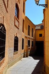 Traditional old Spanish street, in the historic city of Toledo, Spain.