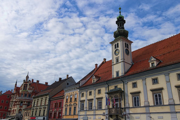 Wall Mural - Amazing landscape view of medieval building against vibrant sky. The Rotovz Town Hall Square in Maribor. Famous touristic place and travel destination in Slovenia