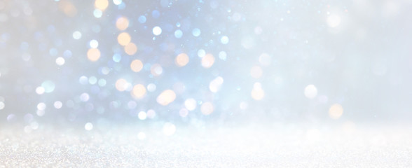 abstract glitter silver, gold , blue lights background. de-focused. banner