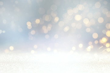 abstract glitter silver, gold lights background. de-focused