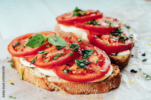 Fotografía Caprese Toast With Mozzarella, Tomatoes And Basil