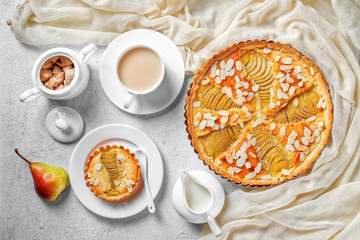 Canvas Print - French poached Pear Tart on a table