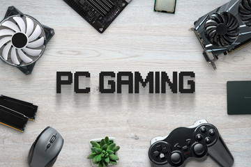 Fototapete - PC gaming flat lay scene with text and gaming computer components and joypad. Top view, close up composition.