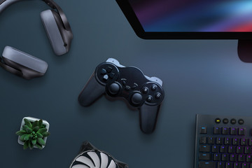 Fototapete - Joypad on desk surrounded with headphones, cooler, keyboard and computer display. PC gaming concept. Top view, flat lay.