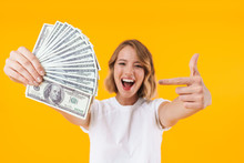 Image Of Excited Blond Woman Holding Bunch Of Money Cash