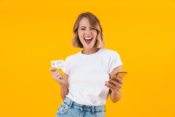 Poster - Image of cheerful blond woman holding smartphone and credit card