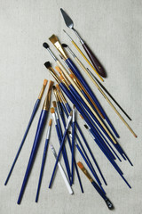 Artist oil Paint Brushes closeup on artistic canvas