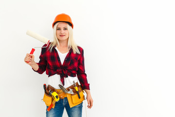 Wall Mural - Young happy woman painting interior wall with paint roller in new house