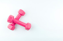 Two Pink Dumbbells Isolated On White Background.