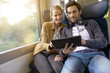 © goodluz - couple traveling in a train