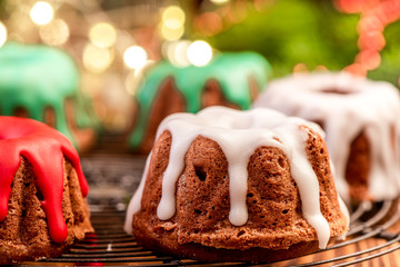 Wall Mural - Homemade Christmas Cake Decorated with Icing on Festive Table